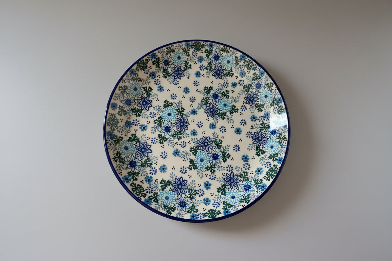 Ceramic plate with floral pattern on a textured surface