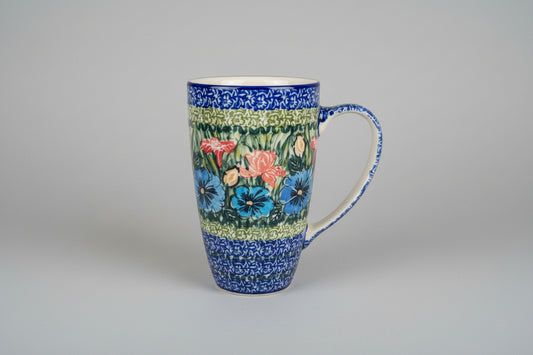 Decorative mug with floral pattern on a lace tablecloth