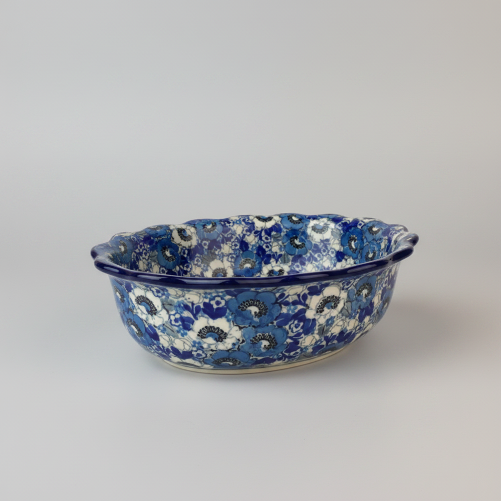 Blue and white floral patterned ceramic bowl on a marble surface