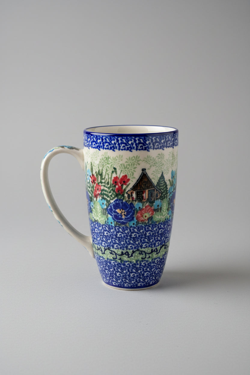 Decorative mug with a scenic design on a lace tablecloth