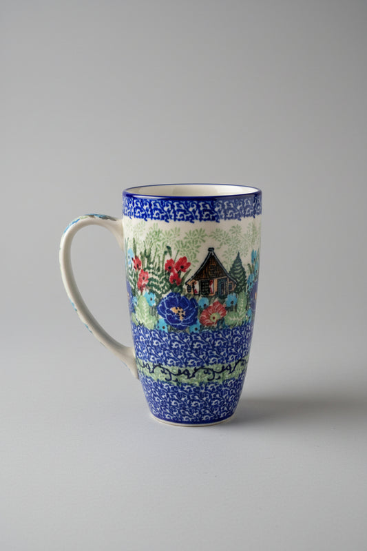 Decorative mug with a scenic design on a lace tablecloth