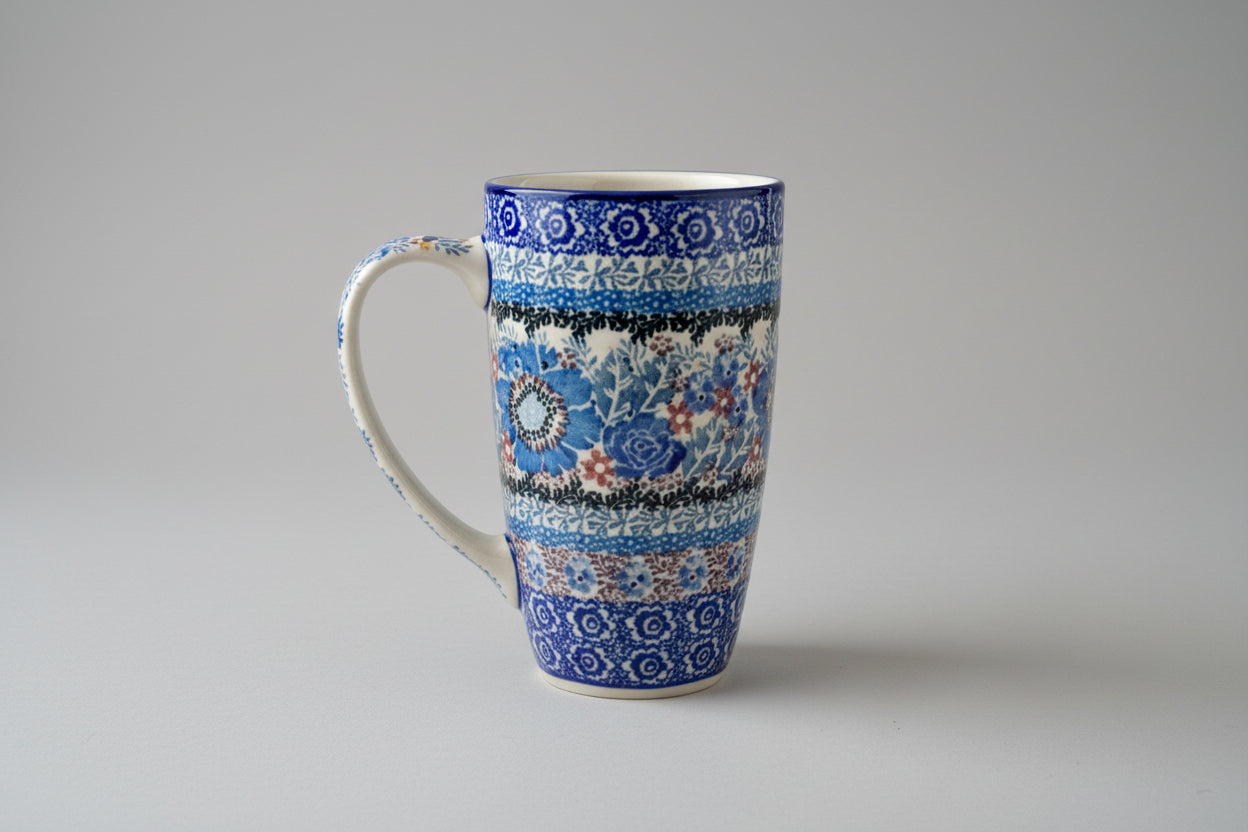 Blue and white patterned mug on a lace tablecloth